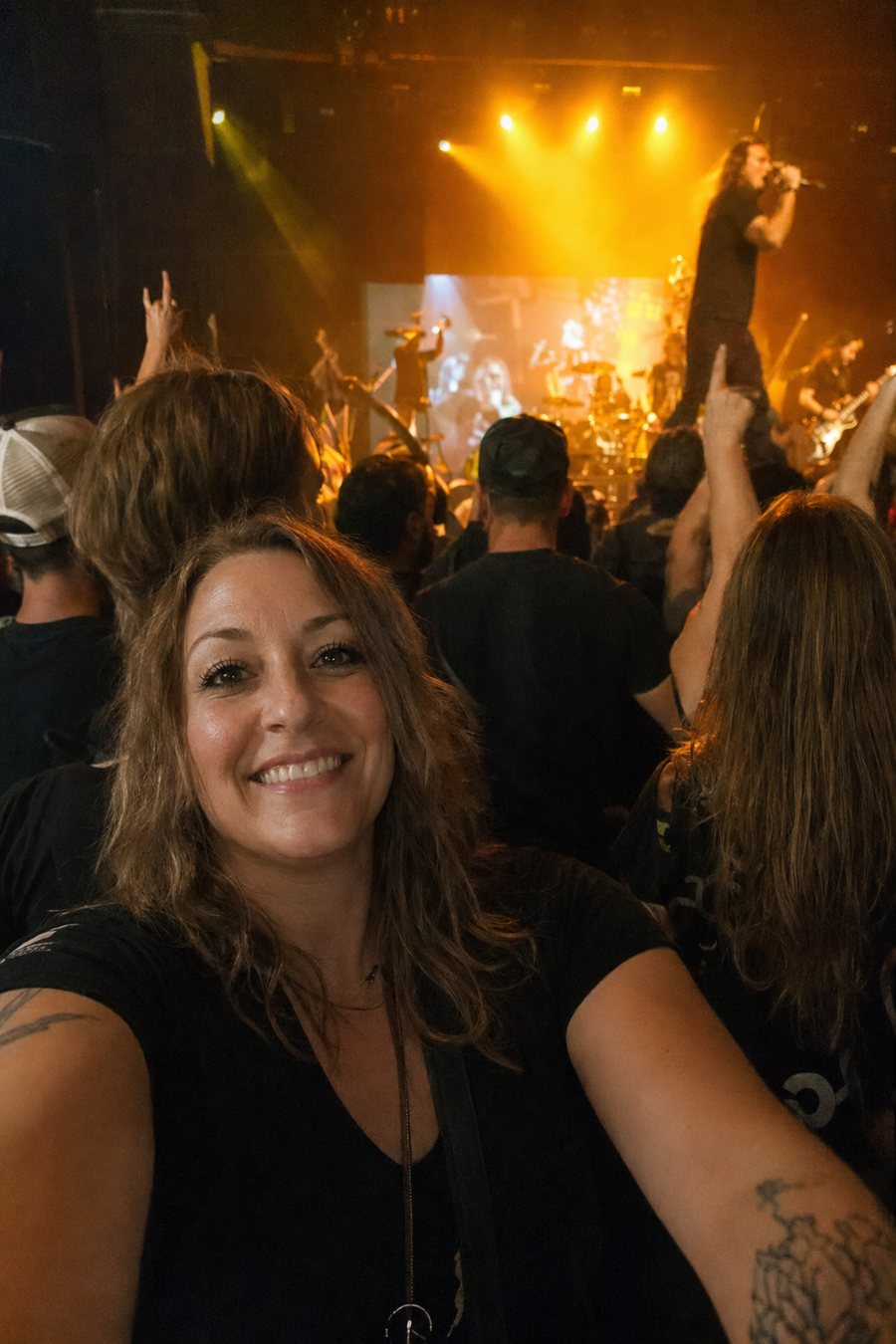 Fan taking a selfie near the front row