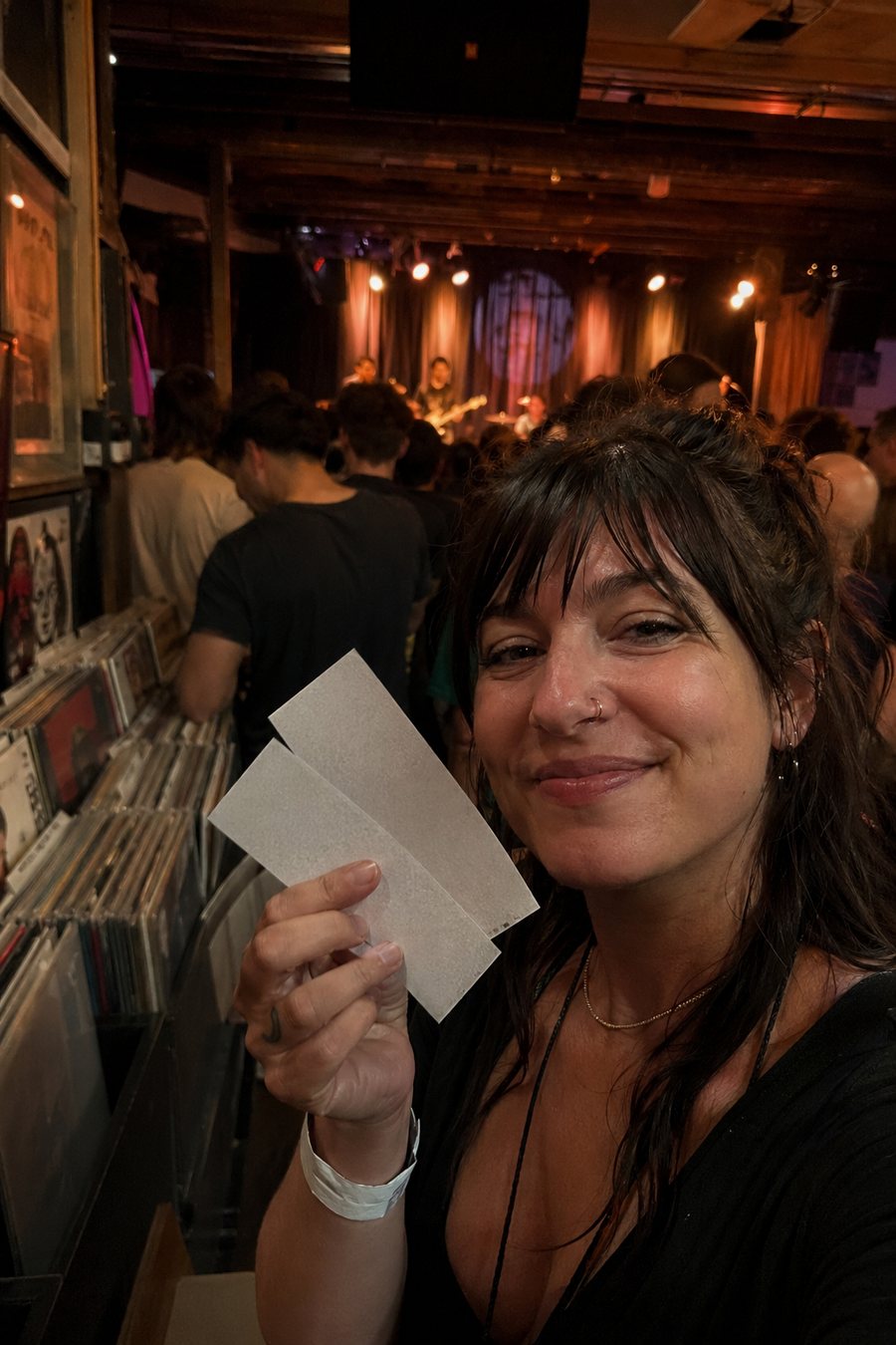 Fan selfie near vinyl records and live music