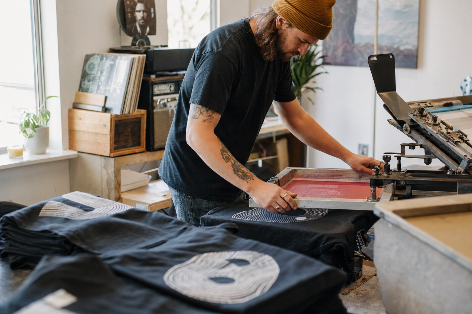 Hand printed Raised By Rhythm tees in Provo, Utah
